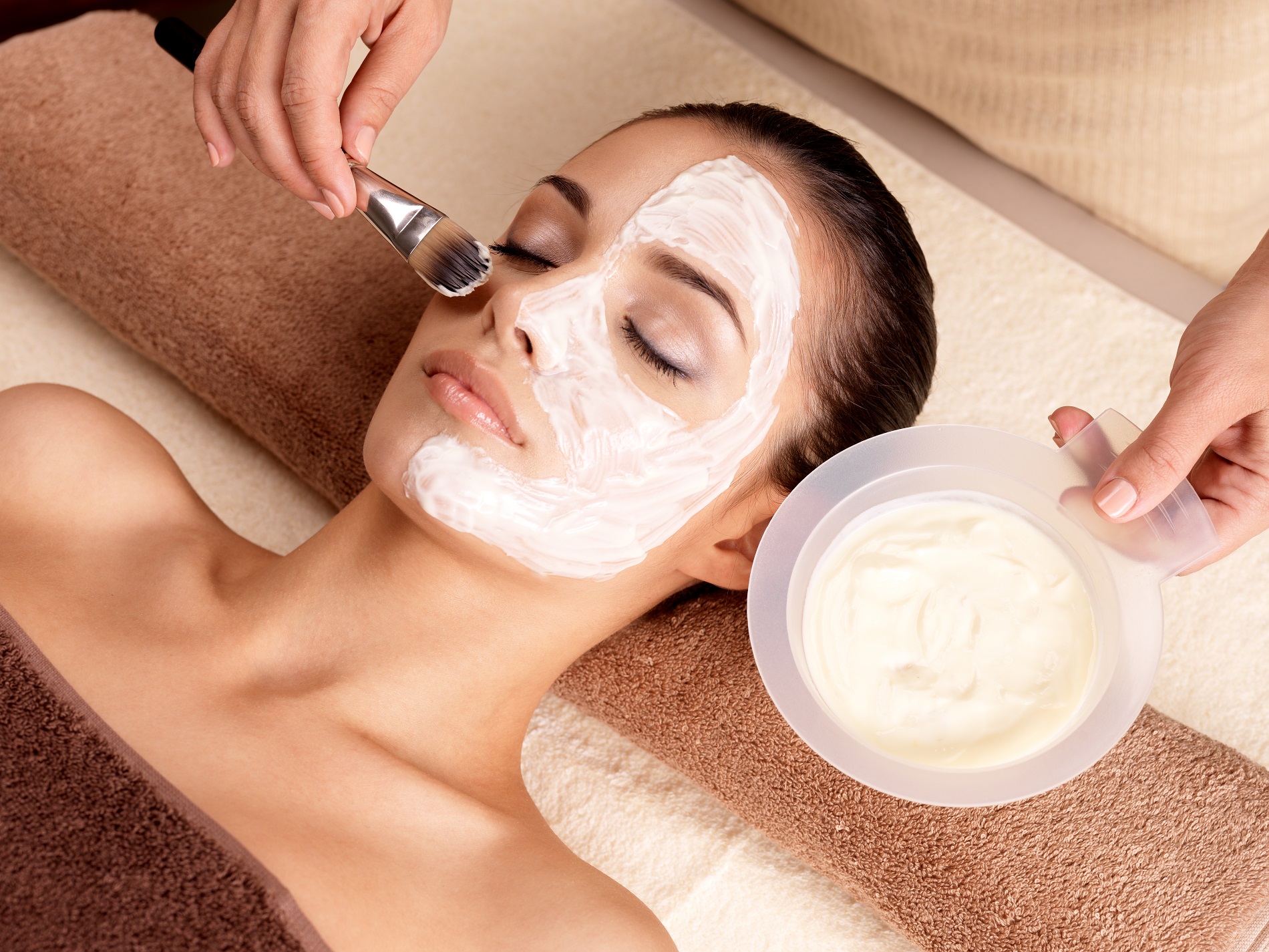 Spa therapy for young woman receiving facial mask at beauty salon - indoors | Soleil Medical & Beauty Spa in Portland, OR