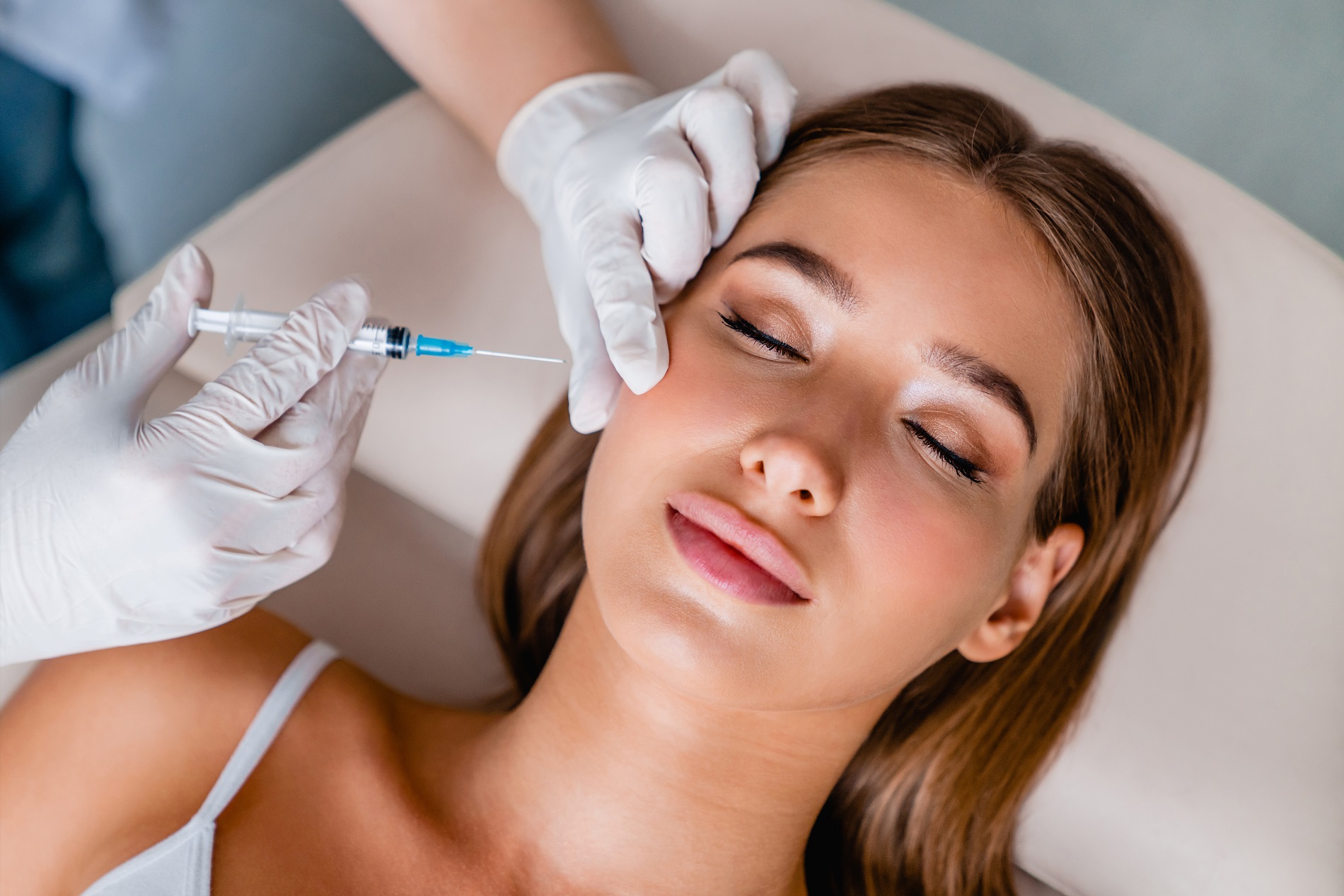 Young woman gets beauty facial injections in salon | Soleill Medical & Beauty Spa in Portland, OR